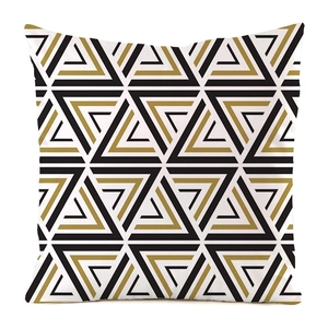 Close-up of geometric triangle pattern and silk texture on modern sofa cushion cover