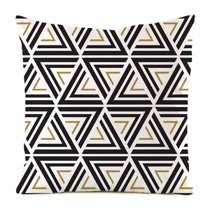 Close-up of geometric diamond and triangle pattern on silk-like decorative cushion cover