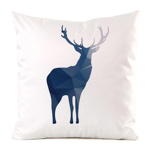 Close-up of white decorative pillow cover with dark blue low-poly elk pattern