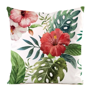 Detail of tropical hibiscus and monstera leaf watercolor print on silk cushion cover