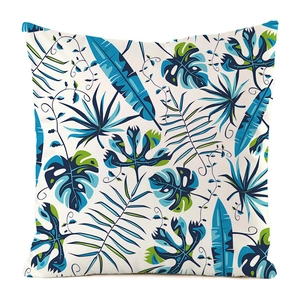 Close-up of tropical leaf print on faux silk square decorative throw pillow cover