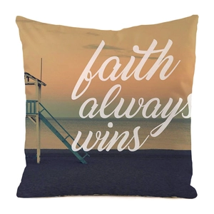 Close-up of faux silk pillow cover featuring sunset beach print and white faith text