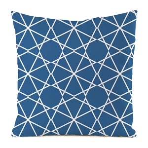 Close-up of navy blue satin cushion cover featuring white geometric lattice pattern print