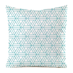 Detail of teal geometric pattern with triangles and lines on white cushion cover fabric