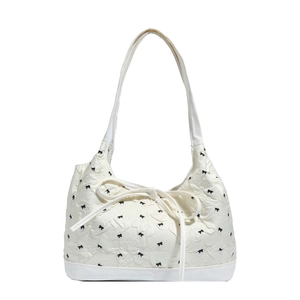 White hobo bag with black bow embroidery and textured wave fabric detail for women
