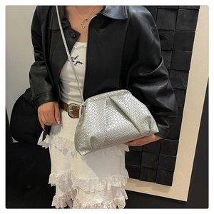Detail of silver woven texture and cloud-style design on stylish shoulder bag
