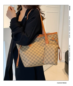 Lifestyle shot of vintage checkered tote bag and small pouch on modern background