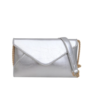 Metallic silver envelope crossbody bag with gold chain strap and textured finish