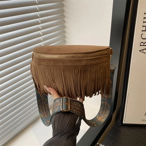 Brown suede fringe waist bag with bohemian printed strap for women in a lifestyle setting