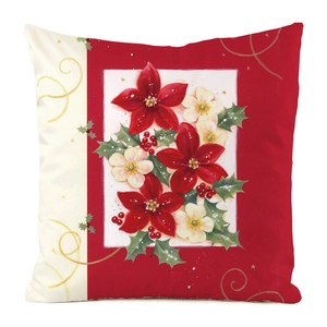 Detail of Christmas pillowcase featuring red poinsettia and berry prints on white fabric