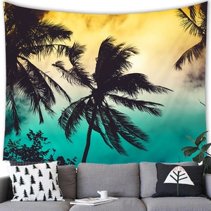 Detail of tropical palm tree silhouette tapestry over a modern gray sofa interior