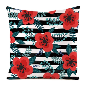 Detail of hand-painted floral silk cushion cover with black and white stripes and red flowers