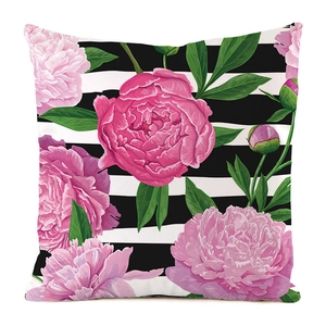 Detail view of pink peony flower print on black and white striped cushion cover