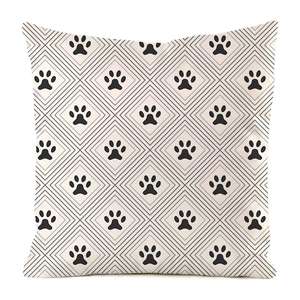 Detailed view of square pillowcase featuring black animal paw prints and grey diamond lines