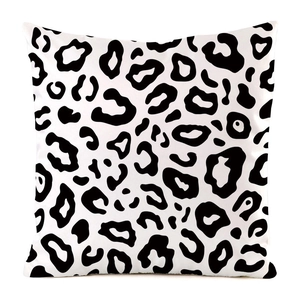 Detailed view of square pillowcase featuring a bold black and white leopard print design