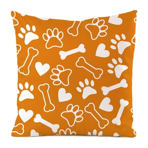 Detail of orange square pillow case with white paw prints, bones and heart patterns