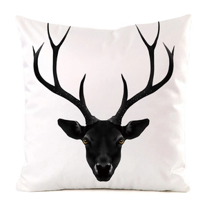 Macro detail of high-quality silk-like fabric showing a deer head print on a white cushion cover