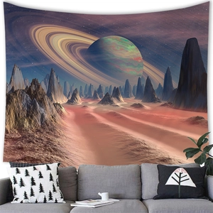 Detail of surreal sunset planet tapestry hanging above a modern grey sofa in a cozy room