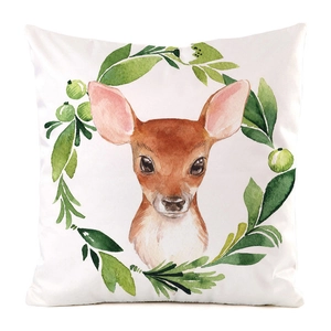 Detail of square cushion cover featuring watercolor deer head and green leaf wreath