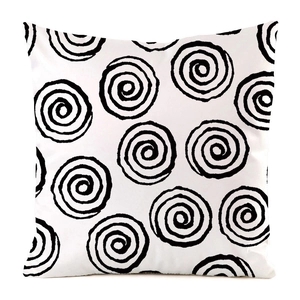 Close-up of black hand-drawn spiral patterns on minimalist white silk texture cushion cover