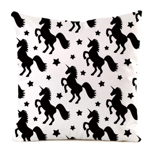 Detail of square cushion cover with black unicorn and star pattern on white faux silk fabric