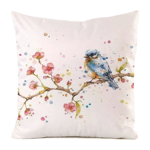 Macro view of watercolor bird and floral pattern on white satin cushion cover