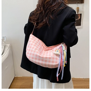 Pink plaid canvas hobo bag with heart embroidery and colorful rainbow charm detail
