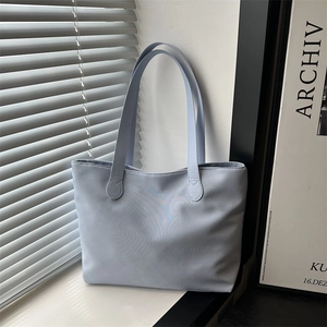 Minimalist light blue large capacity tote bag with long handles for daily commuting