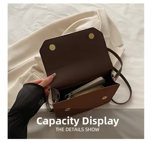 Capacity display of minimalist crossbody bag showing space for smartphone and wallet