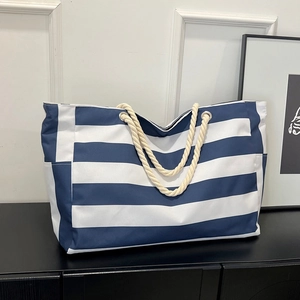 Large nautical navy striped canvas tote bag with thick rope handles for travel