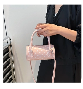Pink polka dot mini Boston bag with adjustable strap and top handles for women