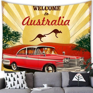Detail of vintage Australia travel poster tapestry hung above a modern gray sofa