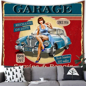 Detail of vintage garage tapestry featuring a classic car hanging over a sofa in a living room