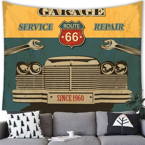 Detail of vintage Route 66 garage tapestry hanging over a sofa in a retro living room
