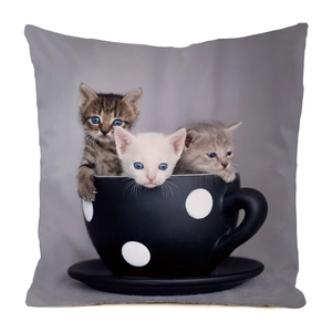 Detail of square cushion cover featuring cute kittens in a polka dot coffee cup