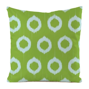 Macro detail of faux silk cushion cover showing green ikat circle texture and fabric weave