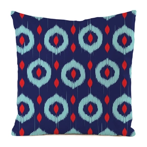 Close-up of the geometric Ikat print texture on the blue square silk cushion cover