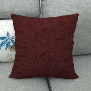 Detailed close-up of dark burgundy linen texture on square sofa cushion cover fabric