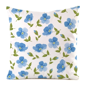 Close-up of small blue floral pattern on white silk-like fabric decorative pillowcase