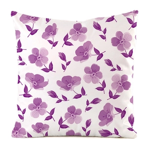 Close-up of purple floral print on white faux silk cushion cover for home decor
