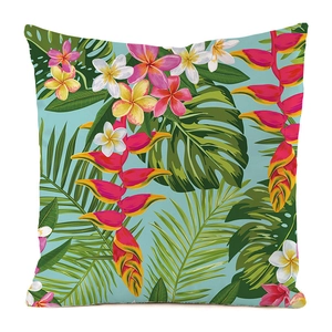Détail macro du motif tropical de frangipanier et monstera sur la housse de coussin