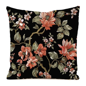 Detailed view of the vibrant floral print on black silk fabric cushion cover for home decor