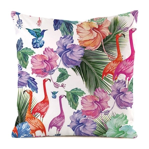 Detail of tropical faux silk cushion cover featuring hummingbirds and floral print