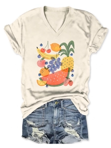 Detail of V-neck off-white t-shirt with colorful fruit prints and ripped denim shorts