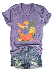 Flat lay of purple V-neck T-shirt with hand-drawn fruit print and distressed denim shorts