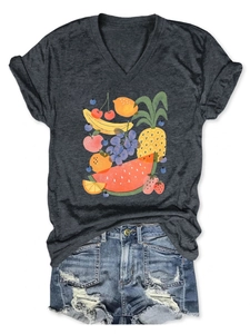 Flat lay of a grey V-neck t-shirt with colorful fruit prints and denim shorts