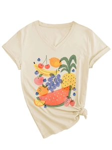 Close-up of cream V-neck T-shirt with vibrant tropical fruit print and side knot detail