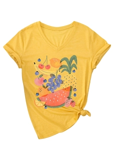 Detail of V-neck yellow cotton T-shirt with vibrant fruit print and stylish front hem knot