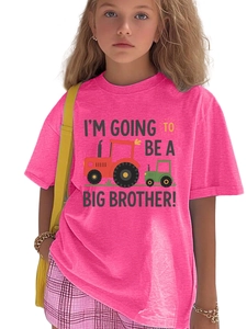 Detail of vibrant pink cotton T-shirt featuring cartoon tractors and Big Brother slogan