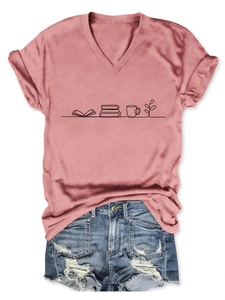 Flat lay of V-neck T-shirt with book and coffee print paired with denim shorts